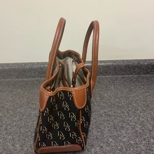 Dooney & Bourke handbag. Black with brown leather trim.